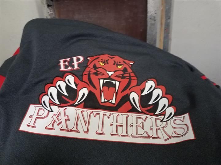 Black athletic jersey with a red and white panther logo and 