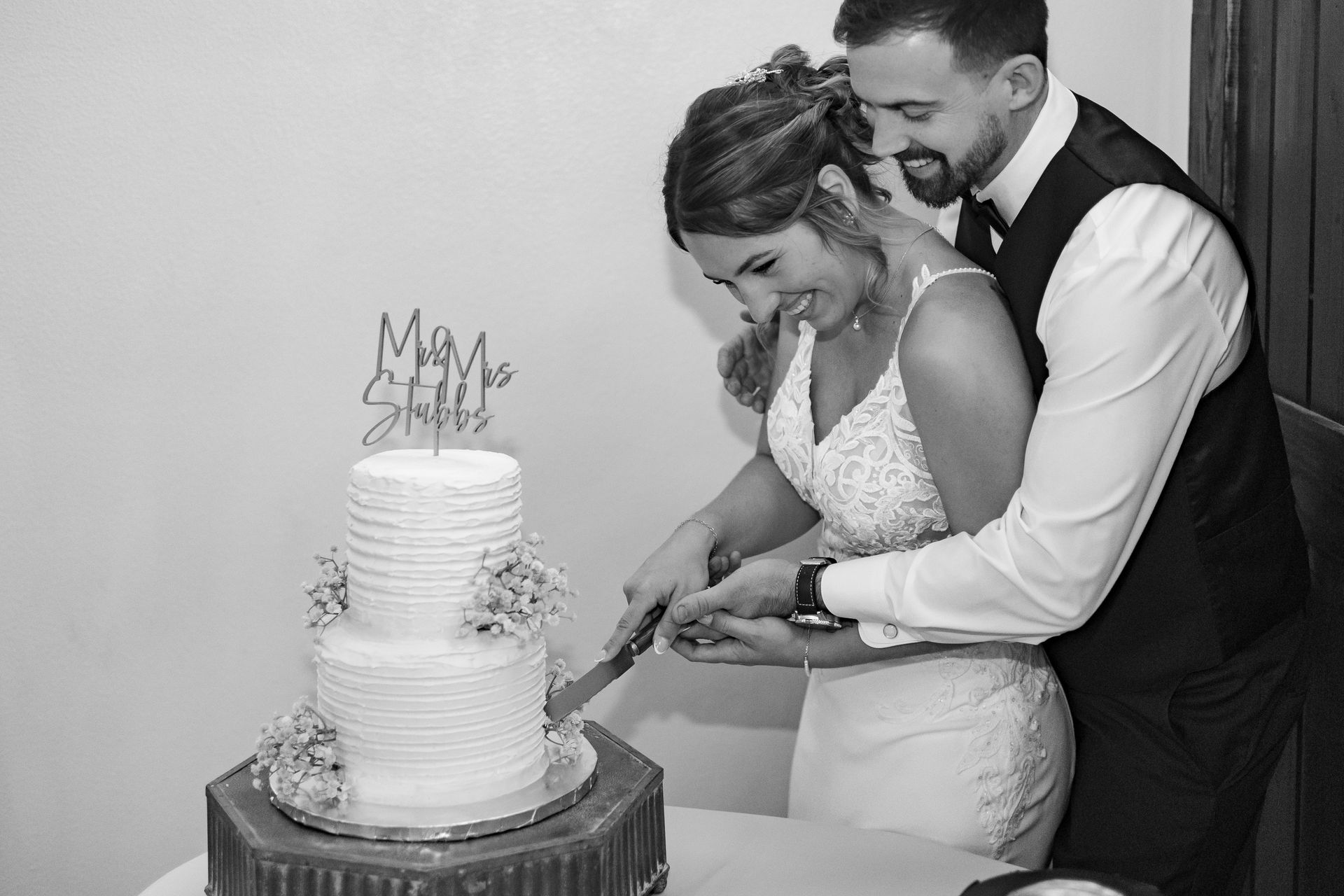 Black and white wedding photo of a couple sharing a moment at Venue 311.