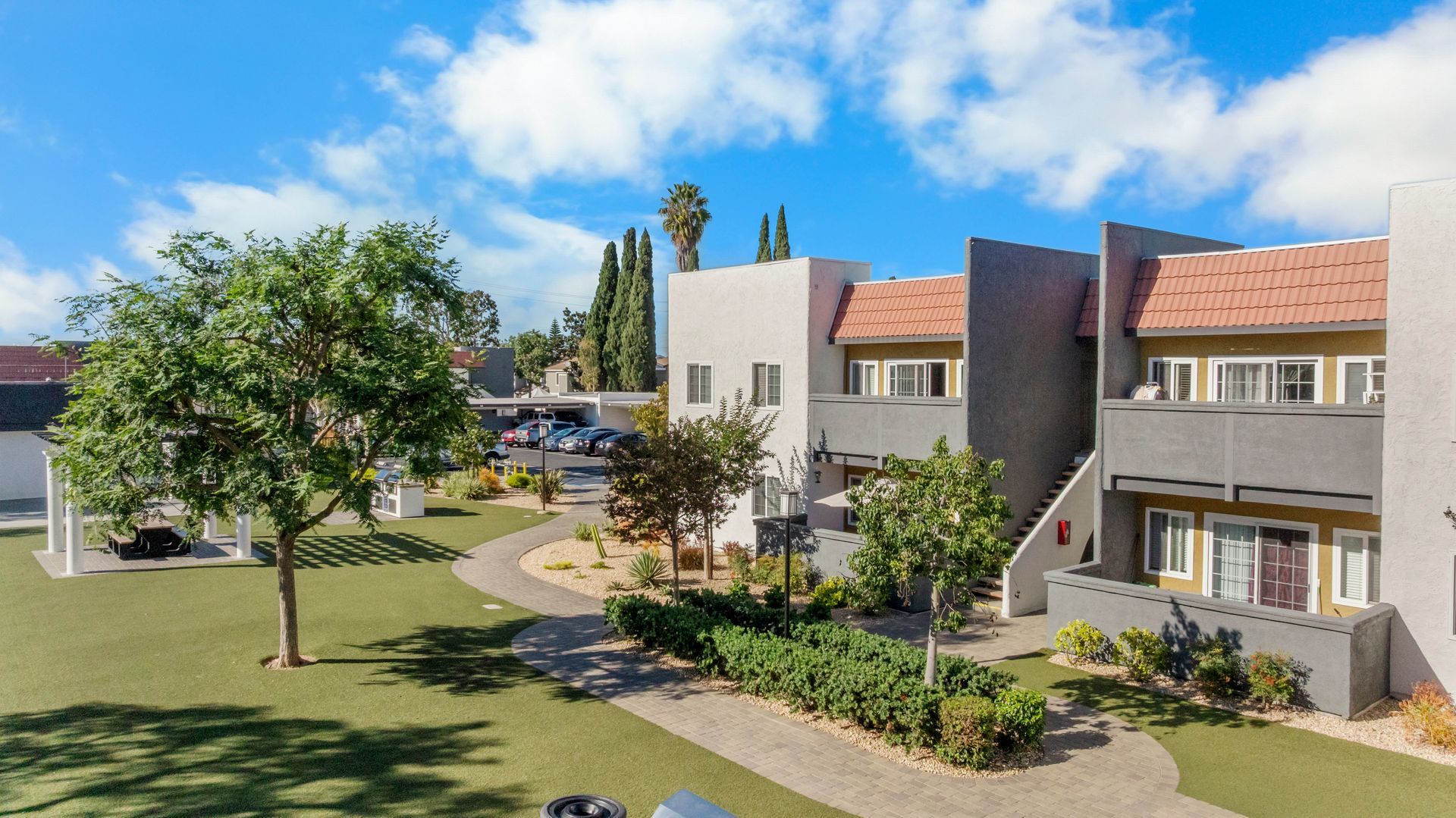 Apartment building exterior with grass and plants
