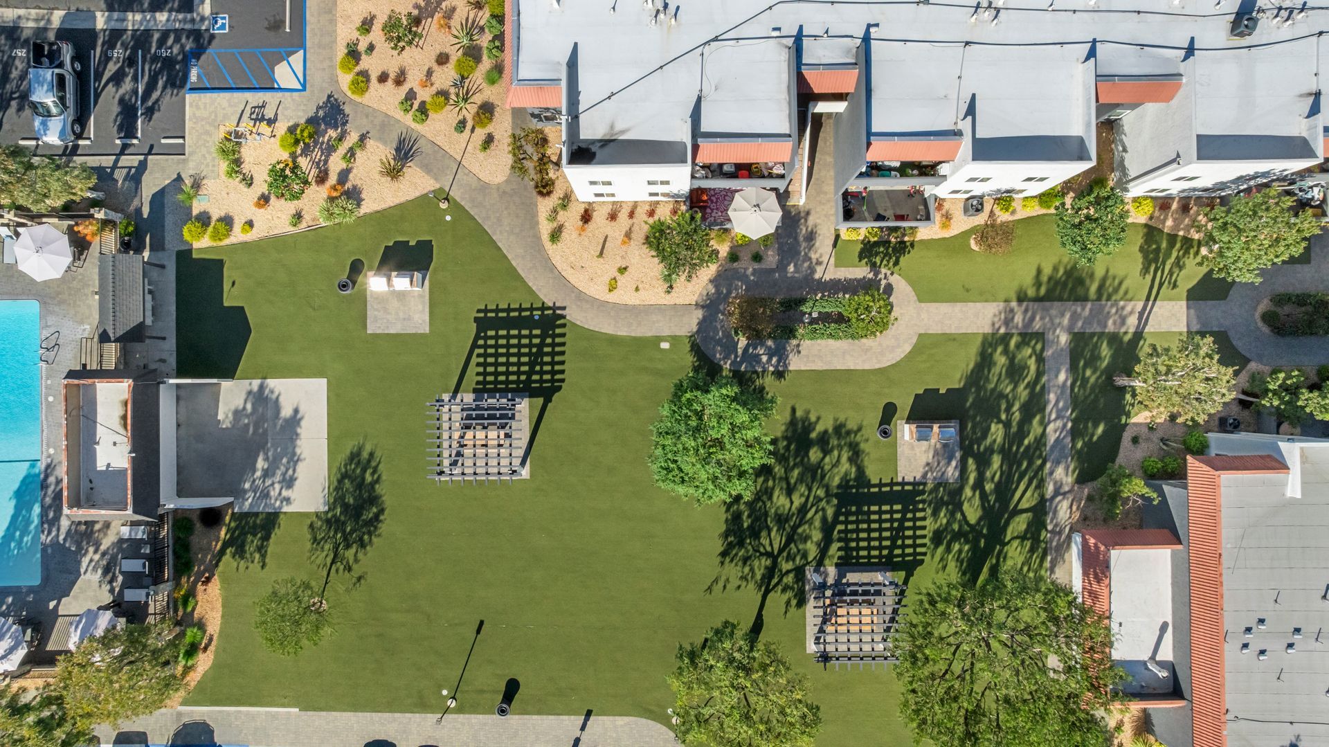 overhead view of grass field with trees and gazebo