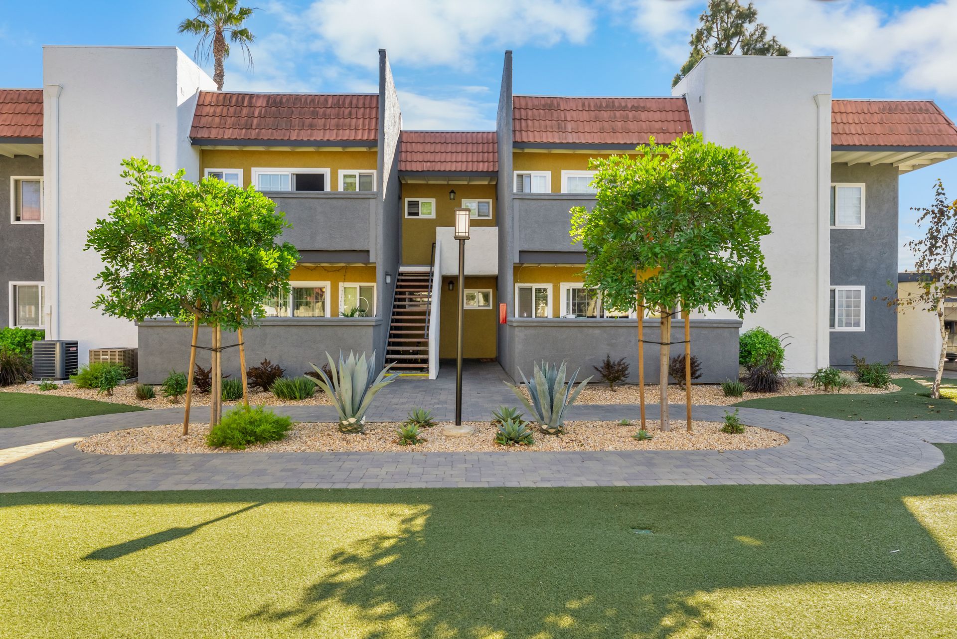 stairs leading up to apartment buildings