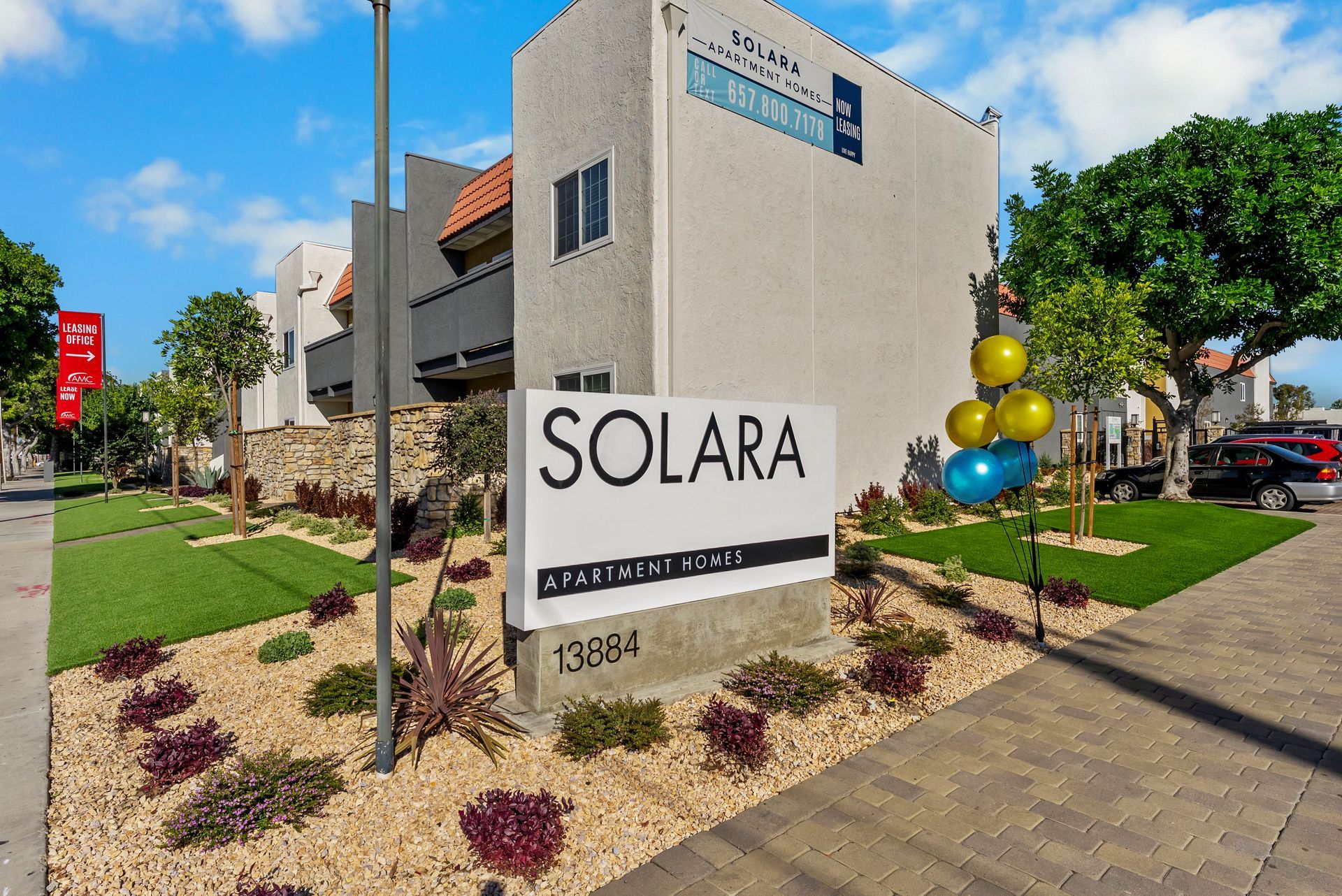solara front sign with balloon and landscaping