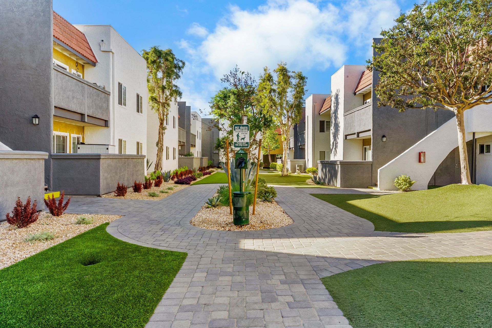 dog waste pick up station at end of path