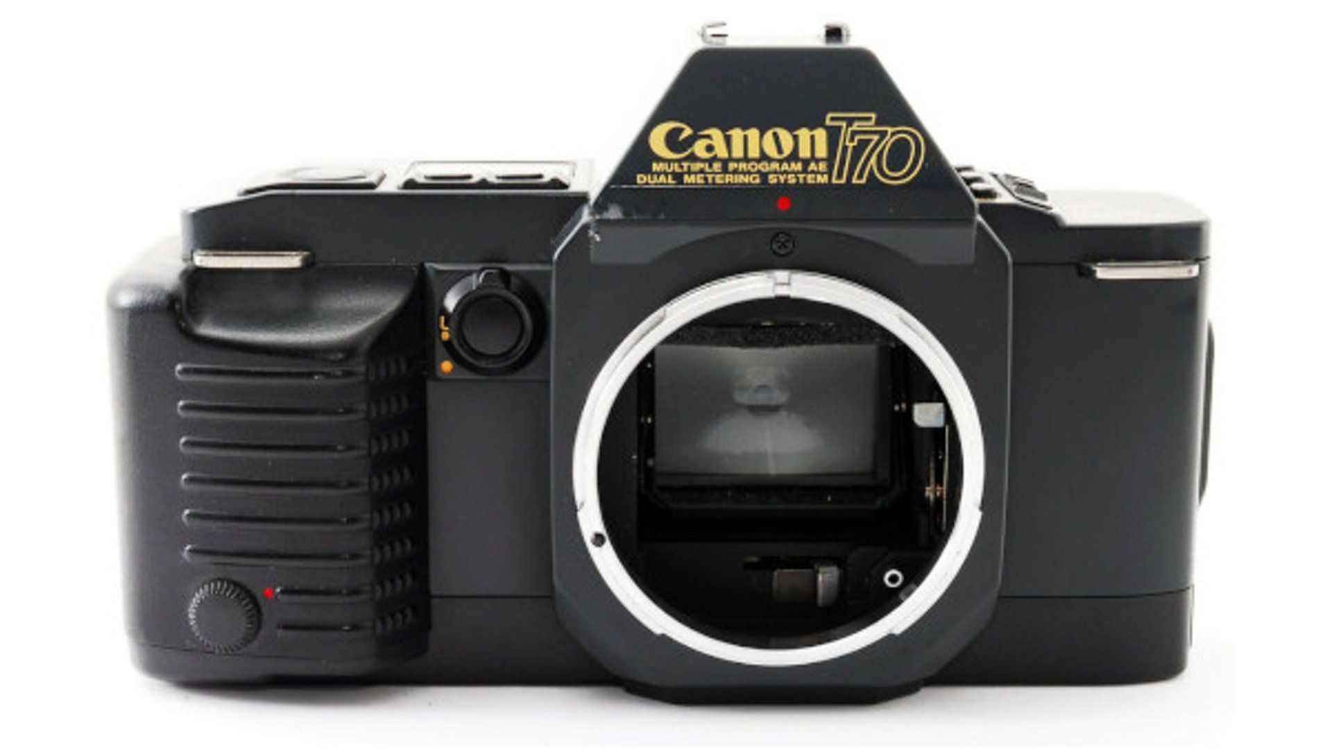 A black canon camera is sitting on a white surface