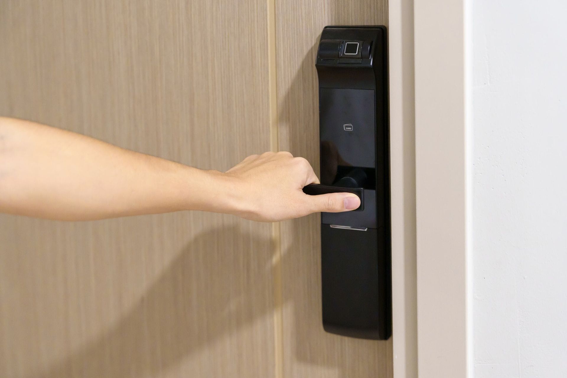 A Person is Opening a Door With a Fingerprint Lock — Asset Locksmiths in Gatton, QLD