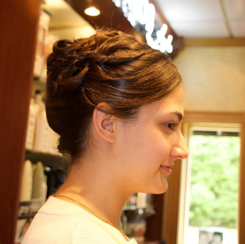 A woman with a braided bun on her head