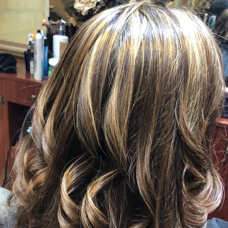 A close up of a woman 's hair in a salon
