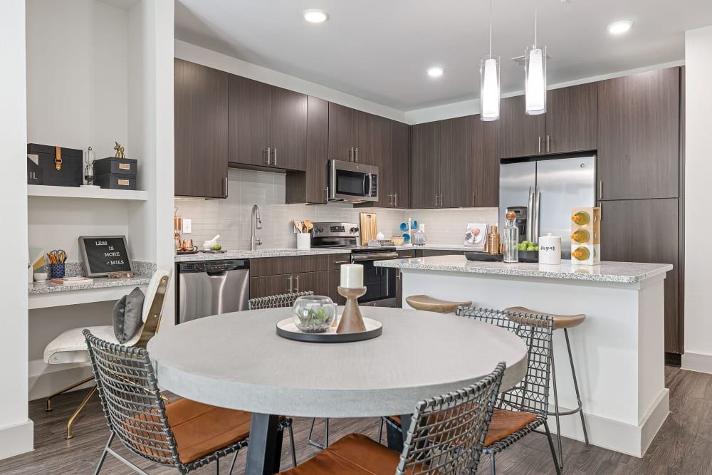 Kitchen and Dining Area at The Nash Apartment Homes in Dallas, TX