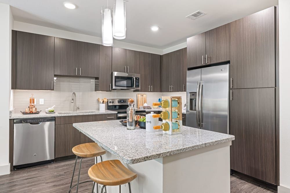 Modern Kitchen with Spacious Island at The Nash Apartment Homes in Dallas, TX