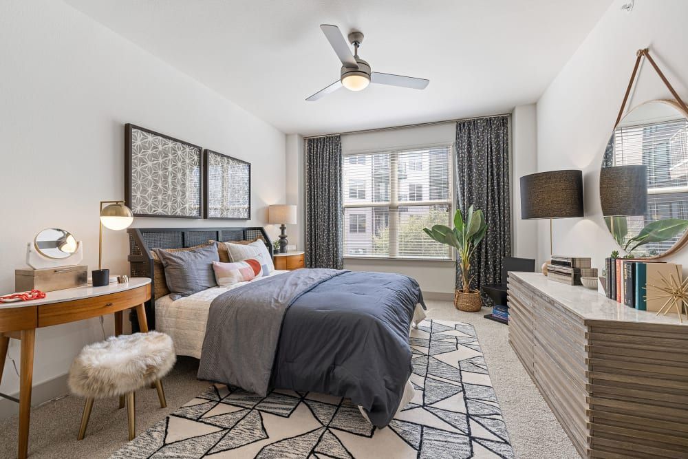 Spacious Bedroom with Ceiling Fan at The Nash Apartment Homes in Dallas, TX