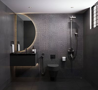 Dark, modern bathroom with black tile, a circular mirror, a toilet, and a shower.