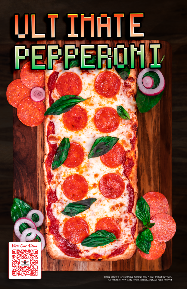 Ultimate pepperoni pizza with basil and red onion on a wooden board.