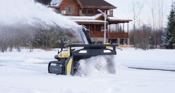 Snow plow clearing heavy slush ridge at driveway entrance after municipal plowing in New Jersey