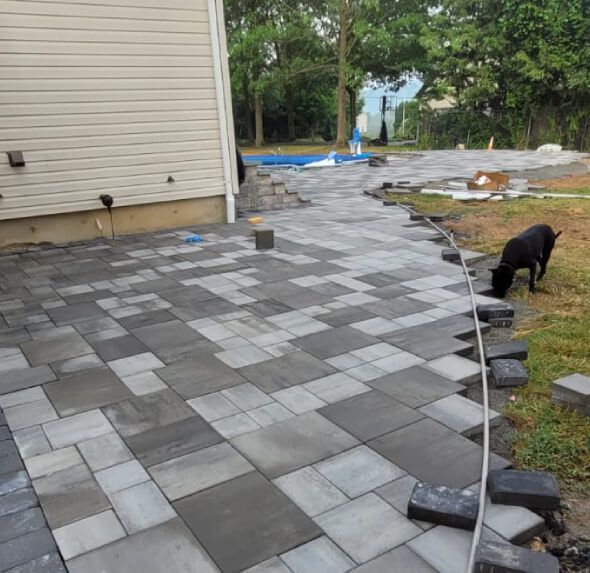 Replacement of cracked and sunken concrete patios in New Jersey with long lasting paver or stone solutions