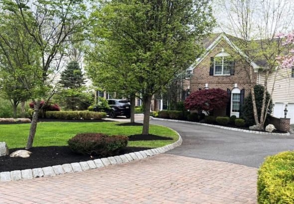 Walkway repair in New Jersey fixing cracked concrete, sunken pavers, and uneven paths caused by freeze thaw damage