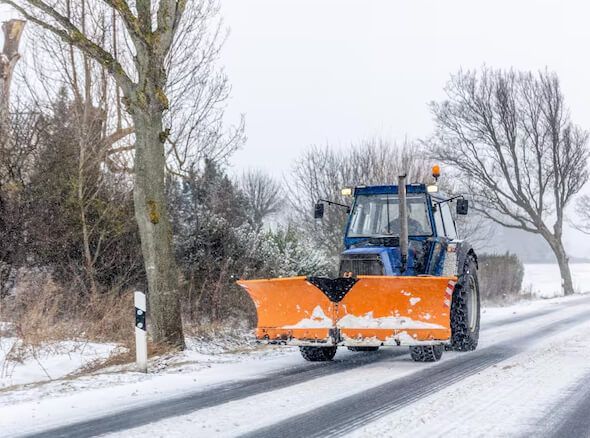 Driveway snow clearing after heavy snowfall in New Jersey with plowed access and cleared entry