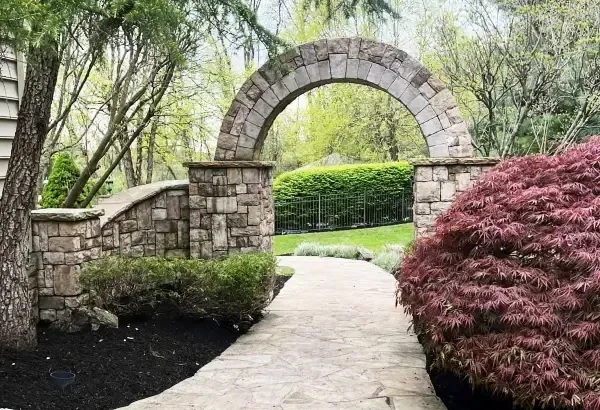 Experienced landscaper working on garden design and plant selection in New Jersey
