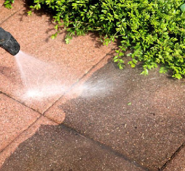 Pressure washing house siding removing black streaks algae and mildew from exterior in New Jersey