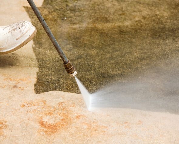 Patio power washing and paver cleaning restoring original color and removing dirt buildup in NJ