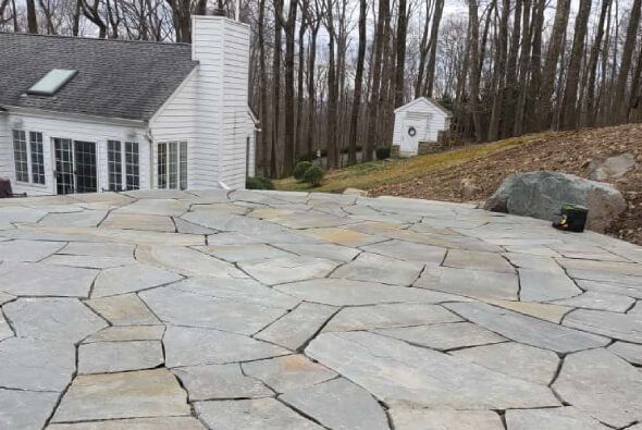 Custom paver patio installation in NJ with multi level designs, edge restraint, and long lasting materials