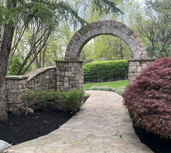 Professional walkway installation with proper excavation, compacted gravel base, and drainage for long lasting results in NJ