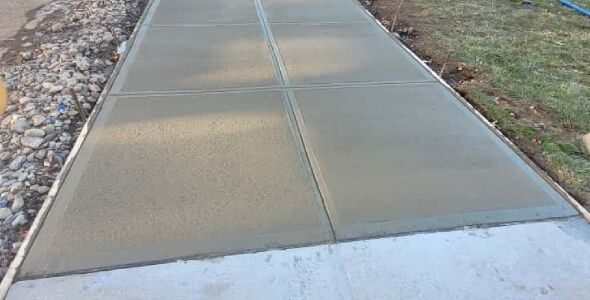 Walkway and sidewalk installation in New Jersey with concrete and paver solutions built for long term durability
