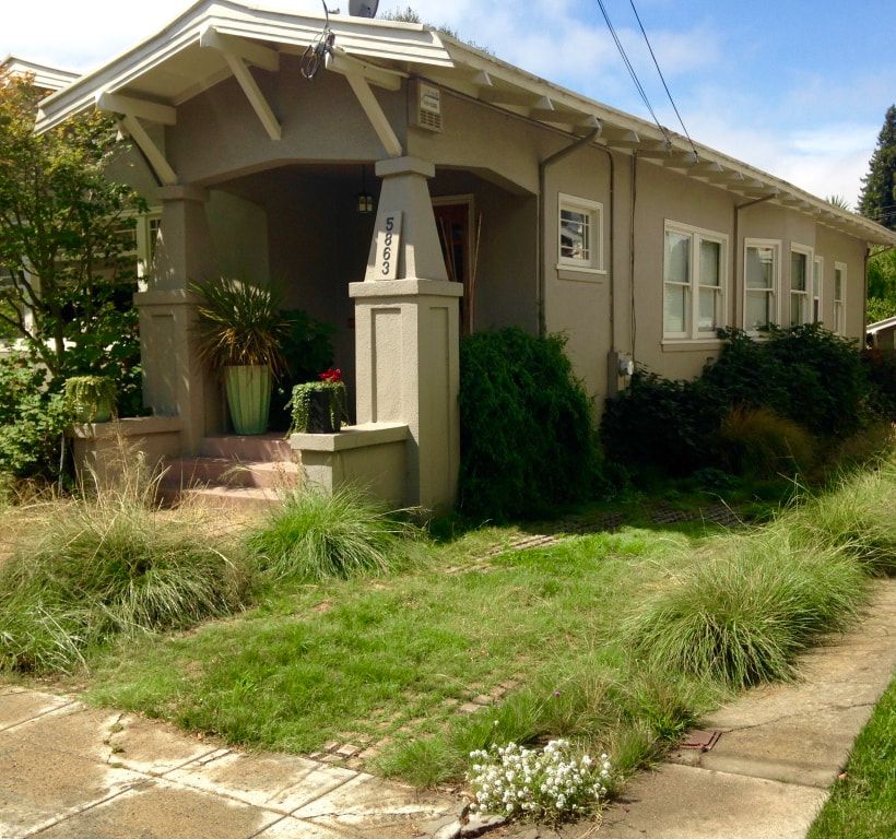 A house with a lot of grass in front of it