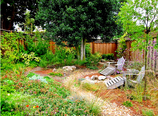 There is a fire pit in the middle of the garden.