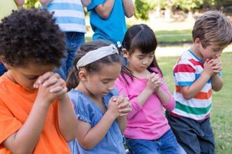 Children saying their prayers - Extracurricular Activities in North Springfield, VA