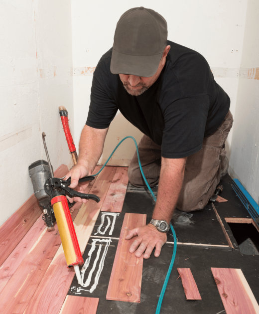 Guy working on floors
