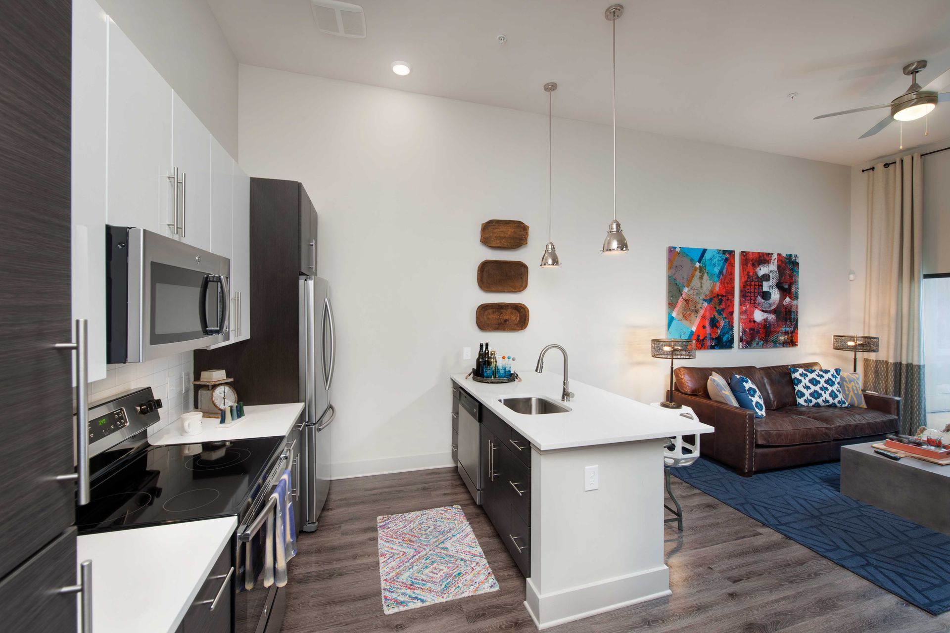 A kitchen with a large island and a couch.