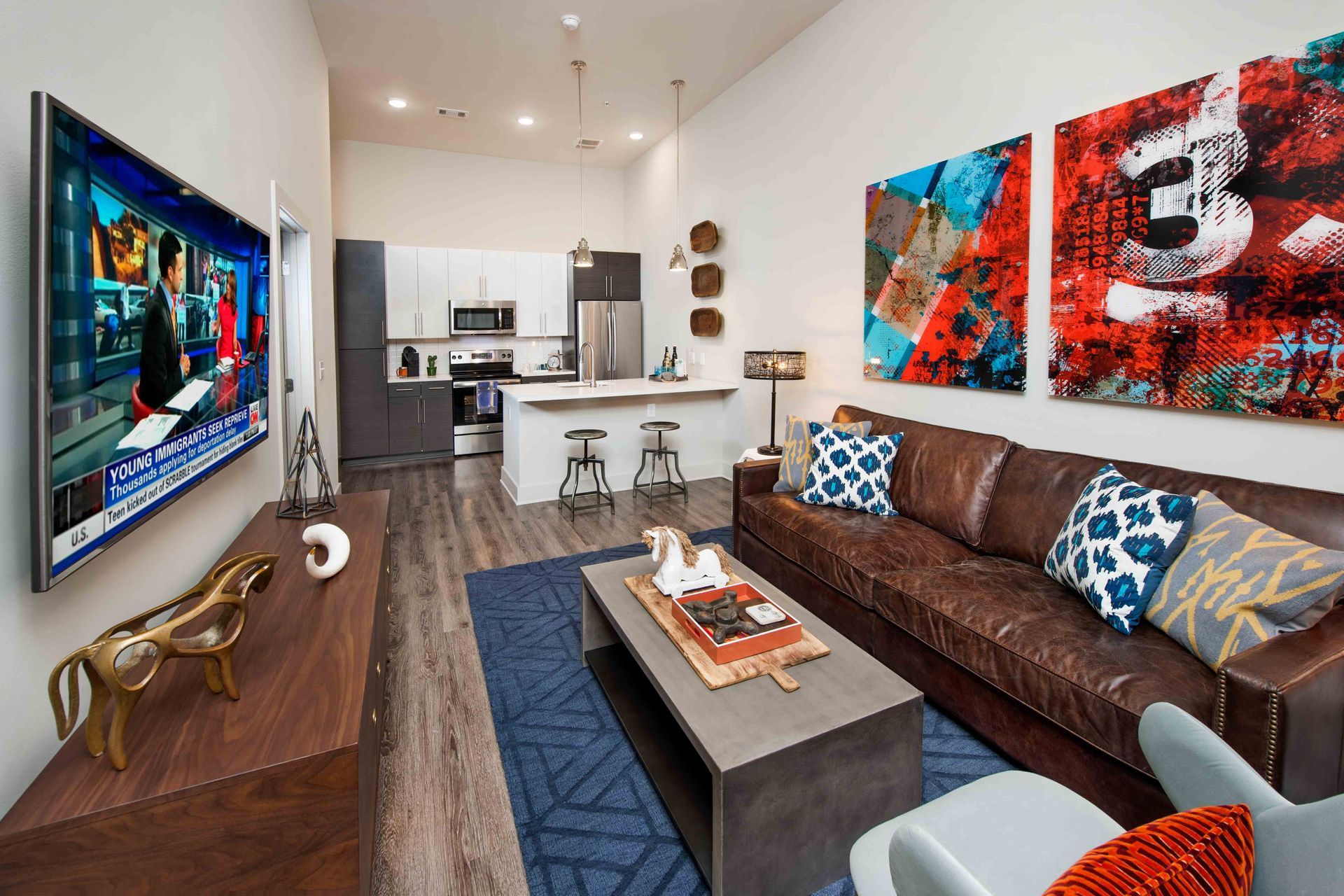 A living room with a couch and a flat screen tv.