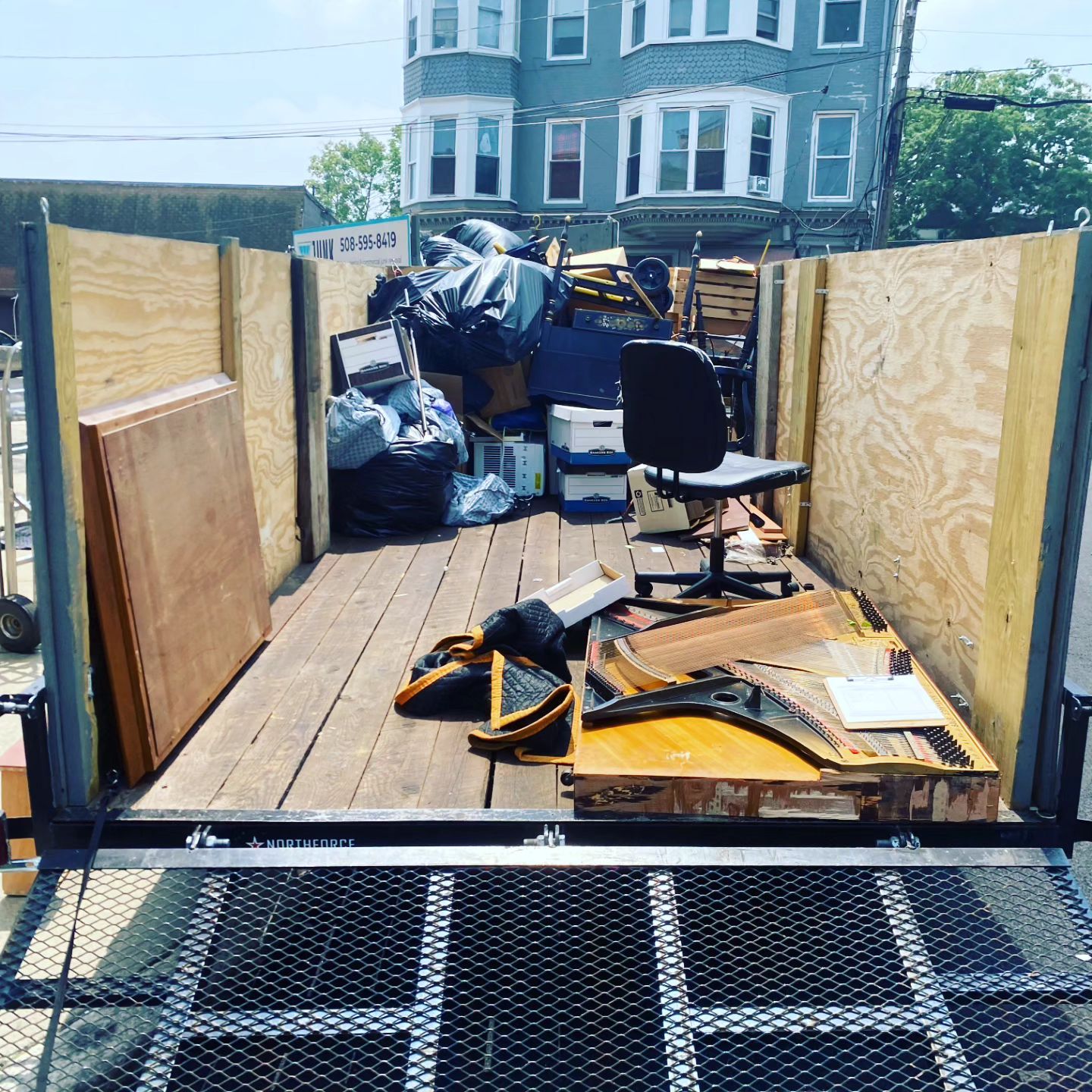 A merry go round is sitting in the middle of a playground.