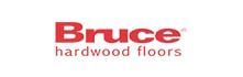the logo for bruce hardwood floors is red and white .