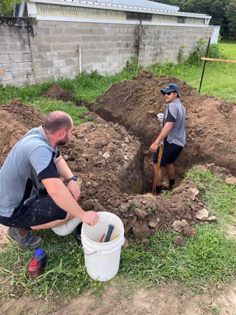 Plumber's Digging A Trench — Plumbing in Townsville, QLD