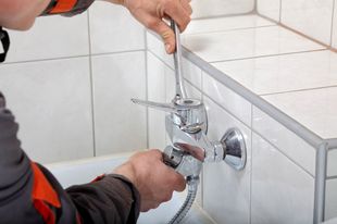 Fixing Water Tap with Spanner — Plumbing in Townsville, QLD