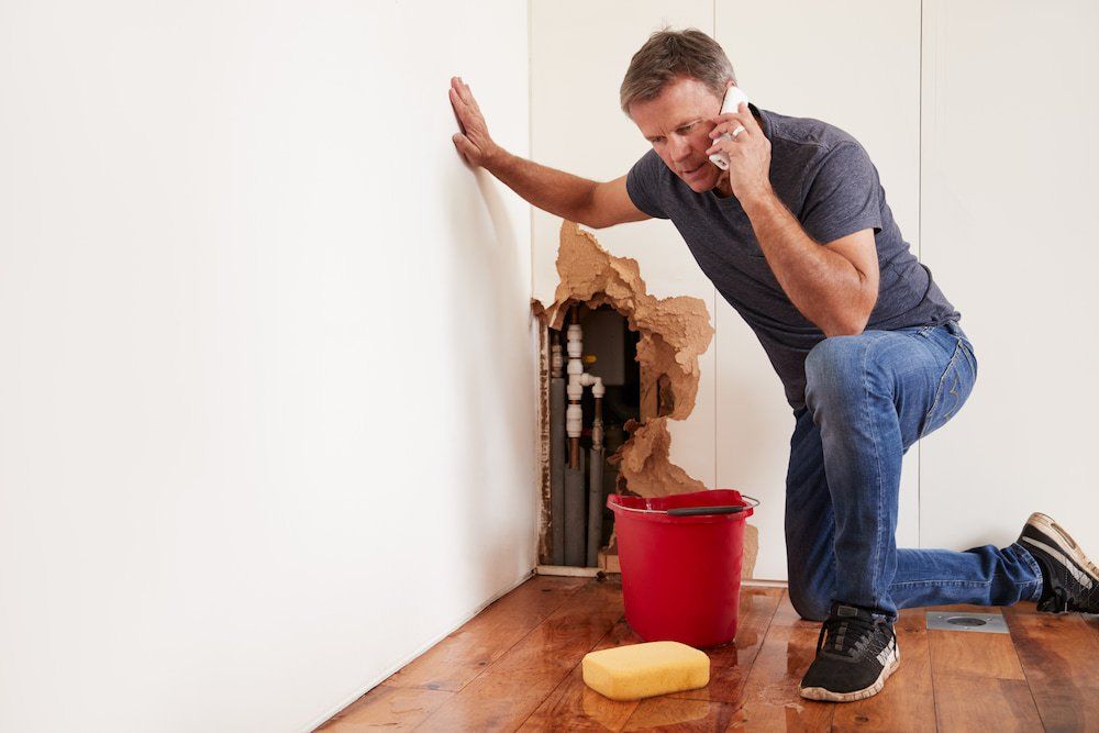 Man Calling for Emergency Plumber — Plumbing in Townsville, QLD