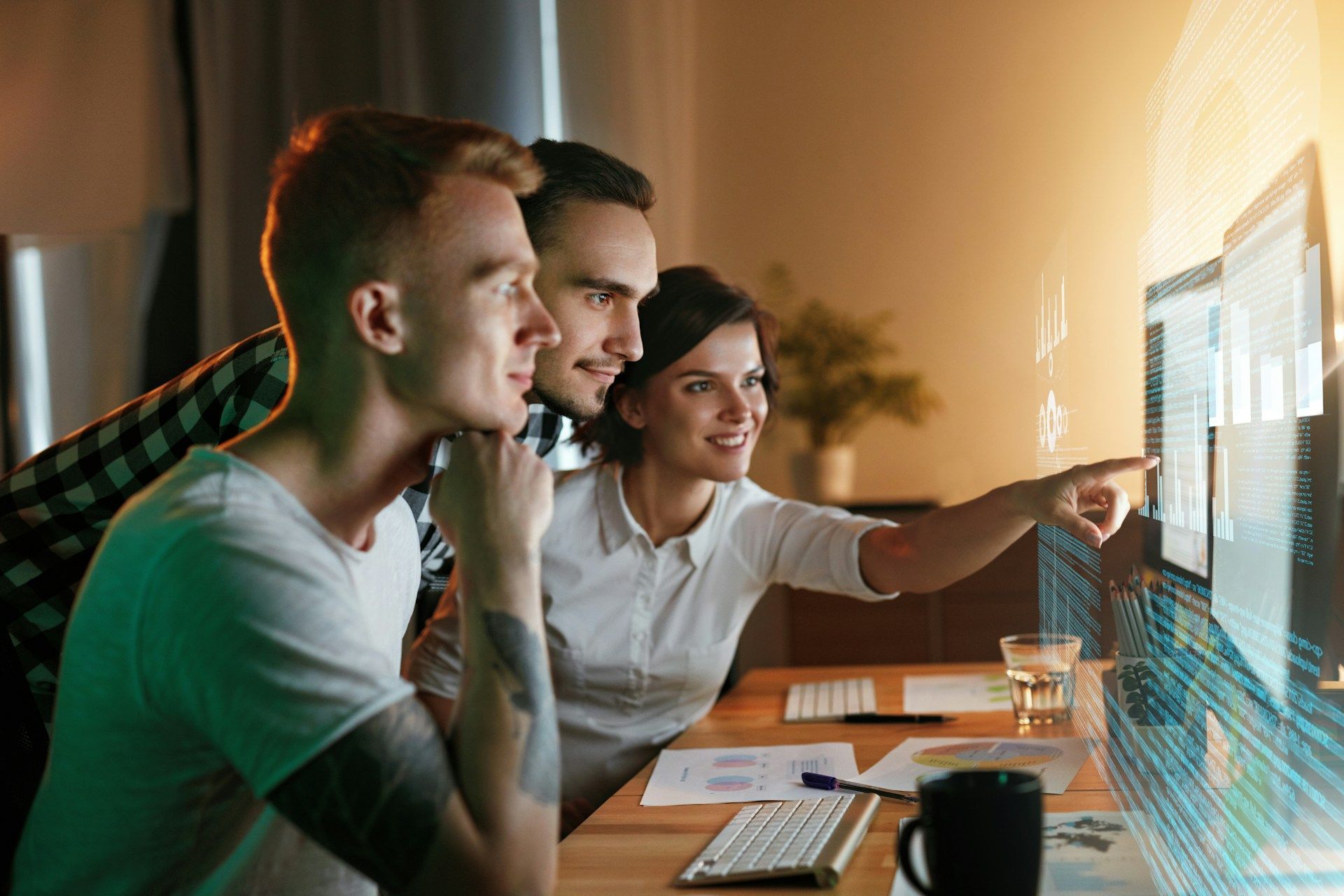 A group of people are looking at a computer screen.