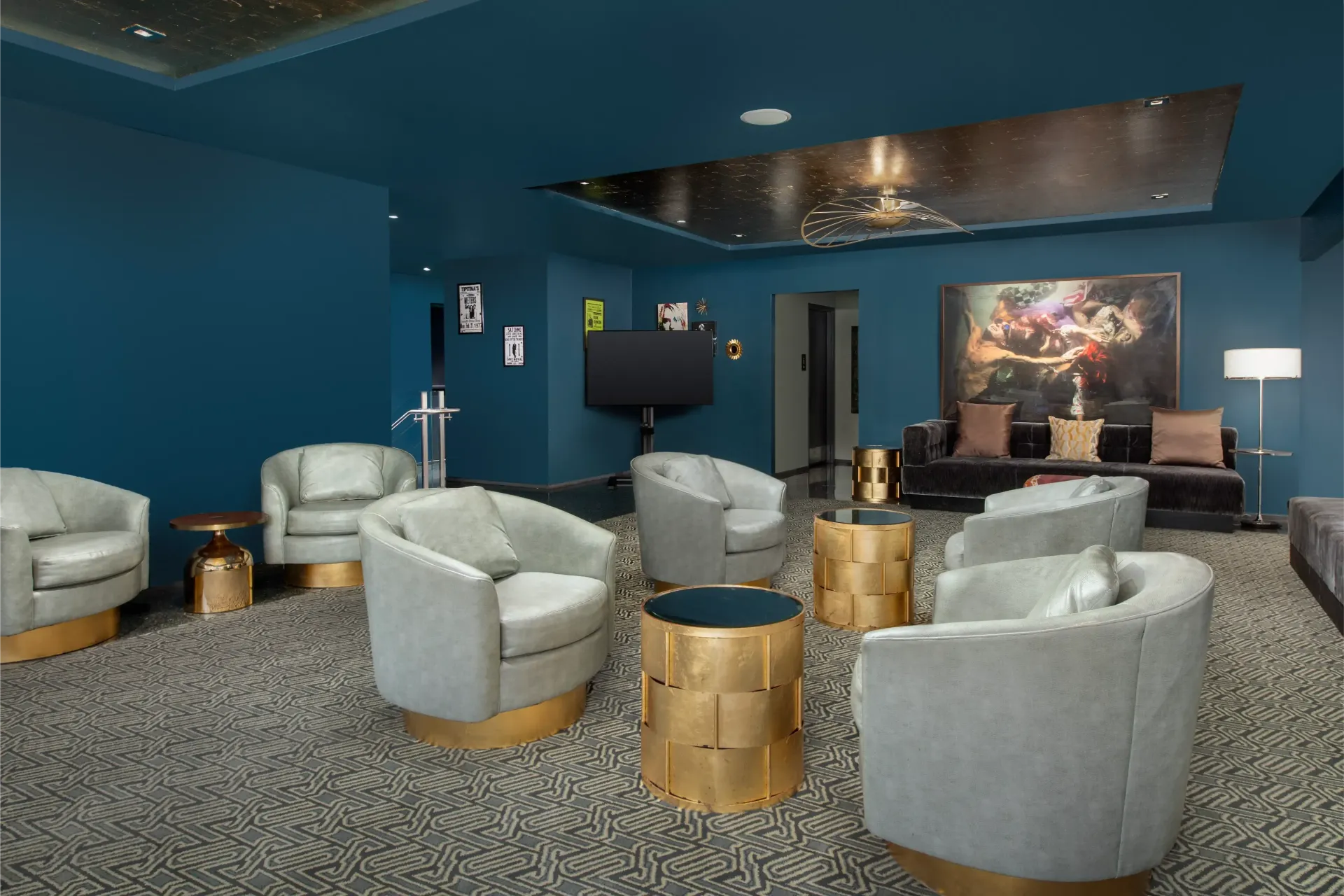 A living room with a lot of chairs and tables