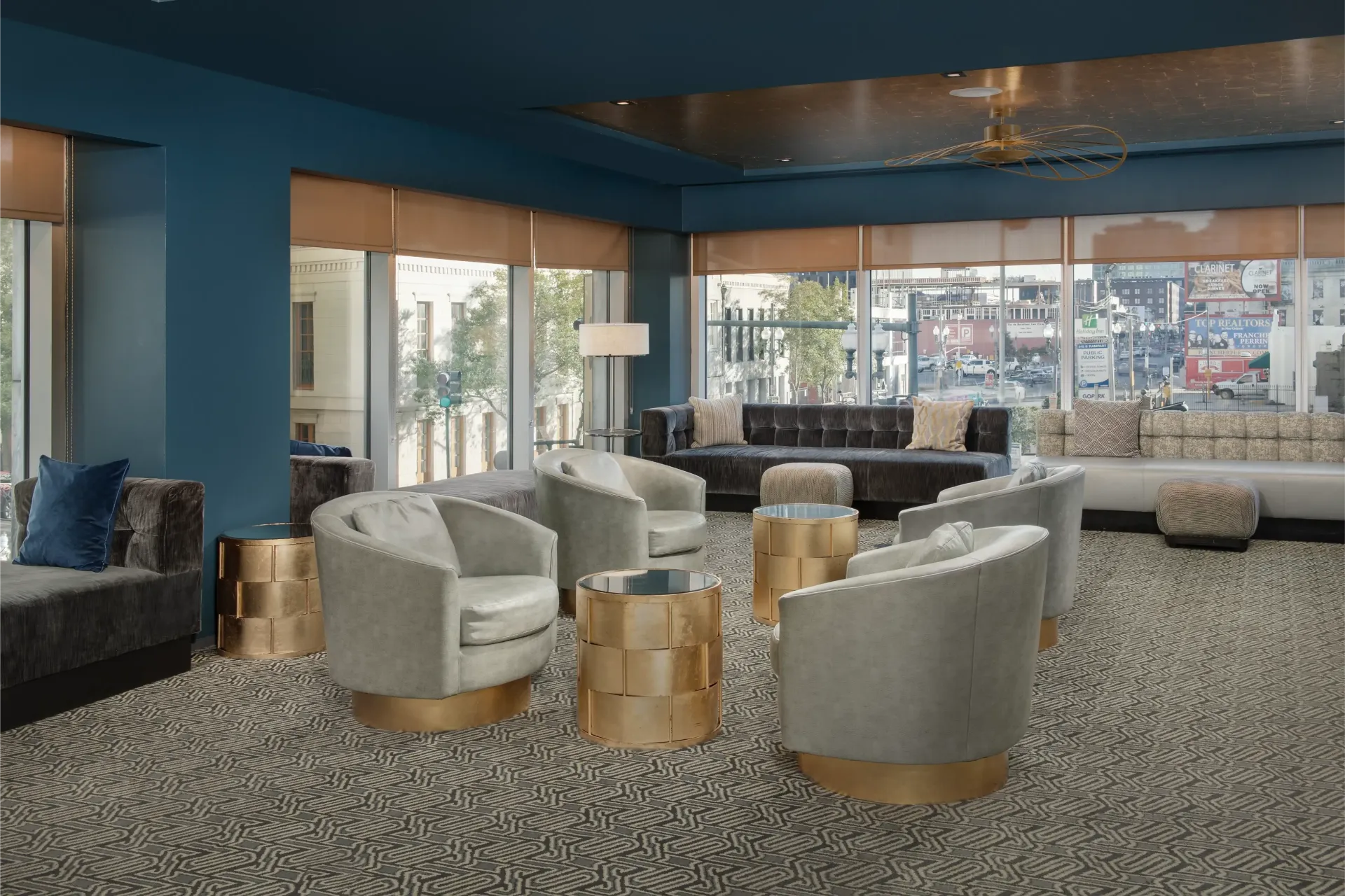 A living room with a lot of chairs and tables