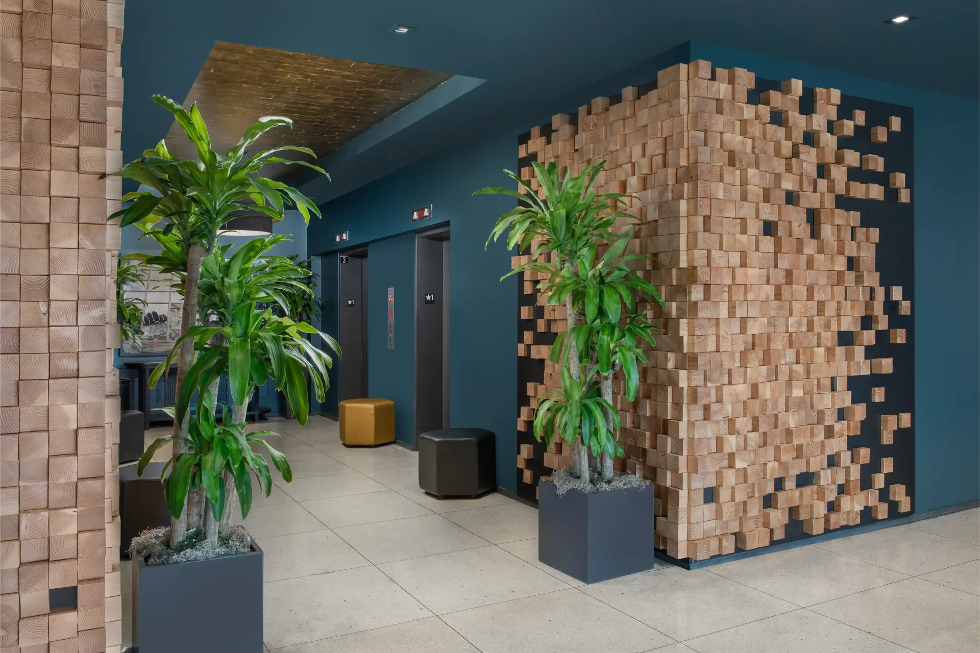 A hallway with a wooden wall and potted plants
