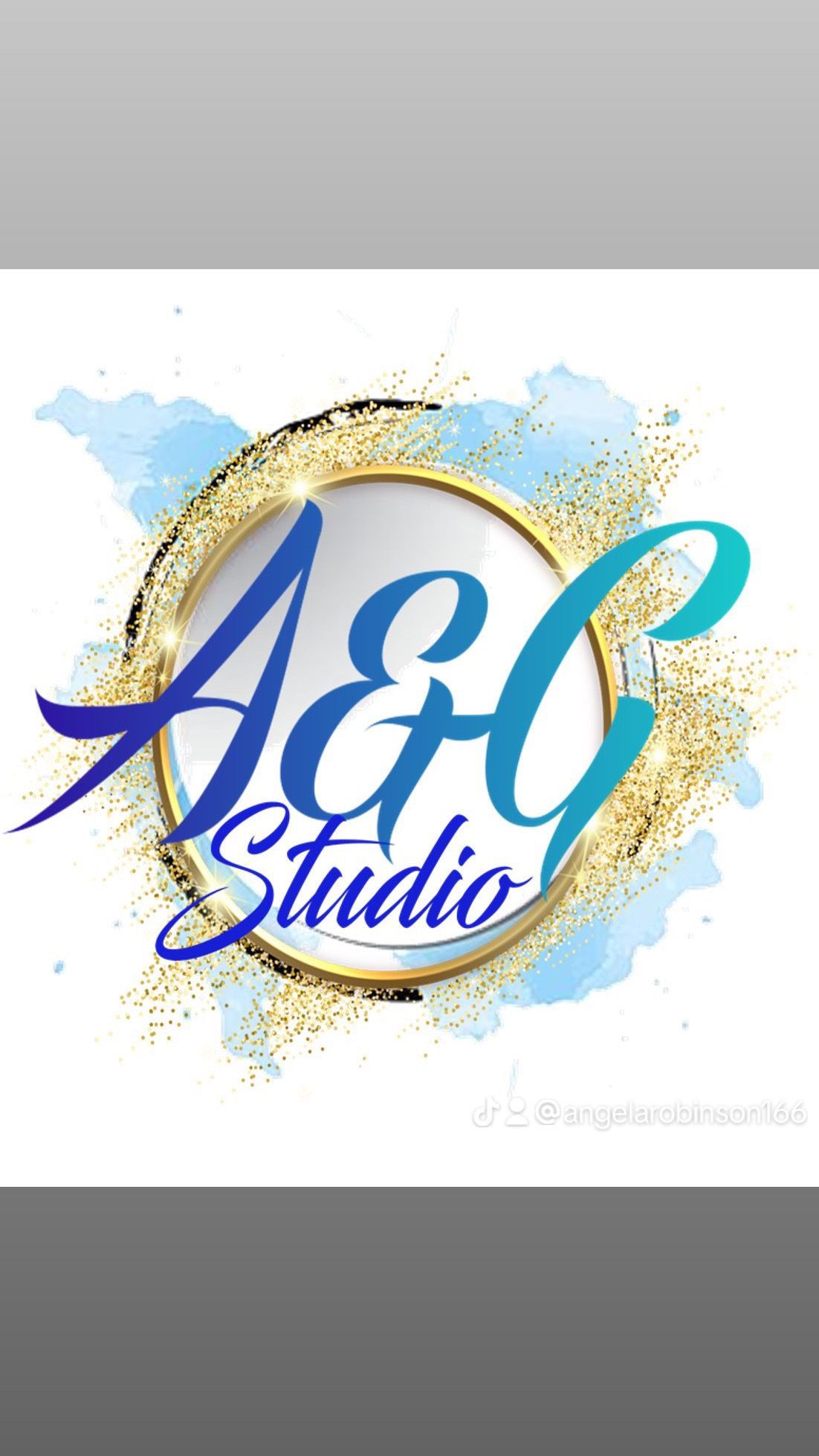 Woman with shaved head wearing a purple top, smiling, and wearing silver hoop earrings.