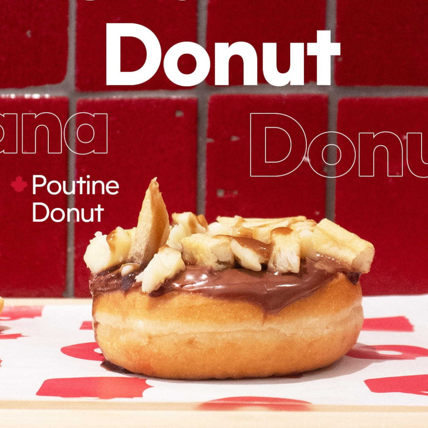 A Poutine Donut topped with gravy and cheese curds, centered against a red-tiled background.