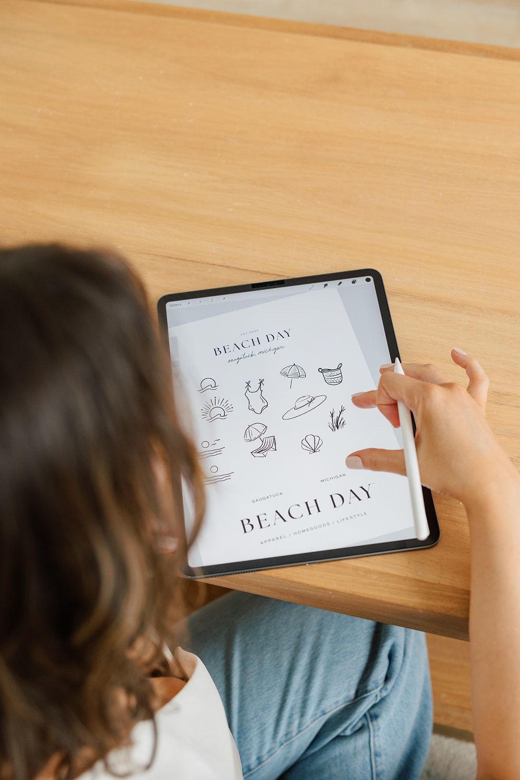 A person using a stylus on a tablet displaying 