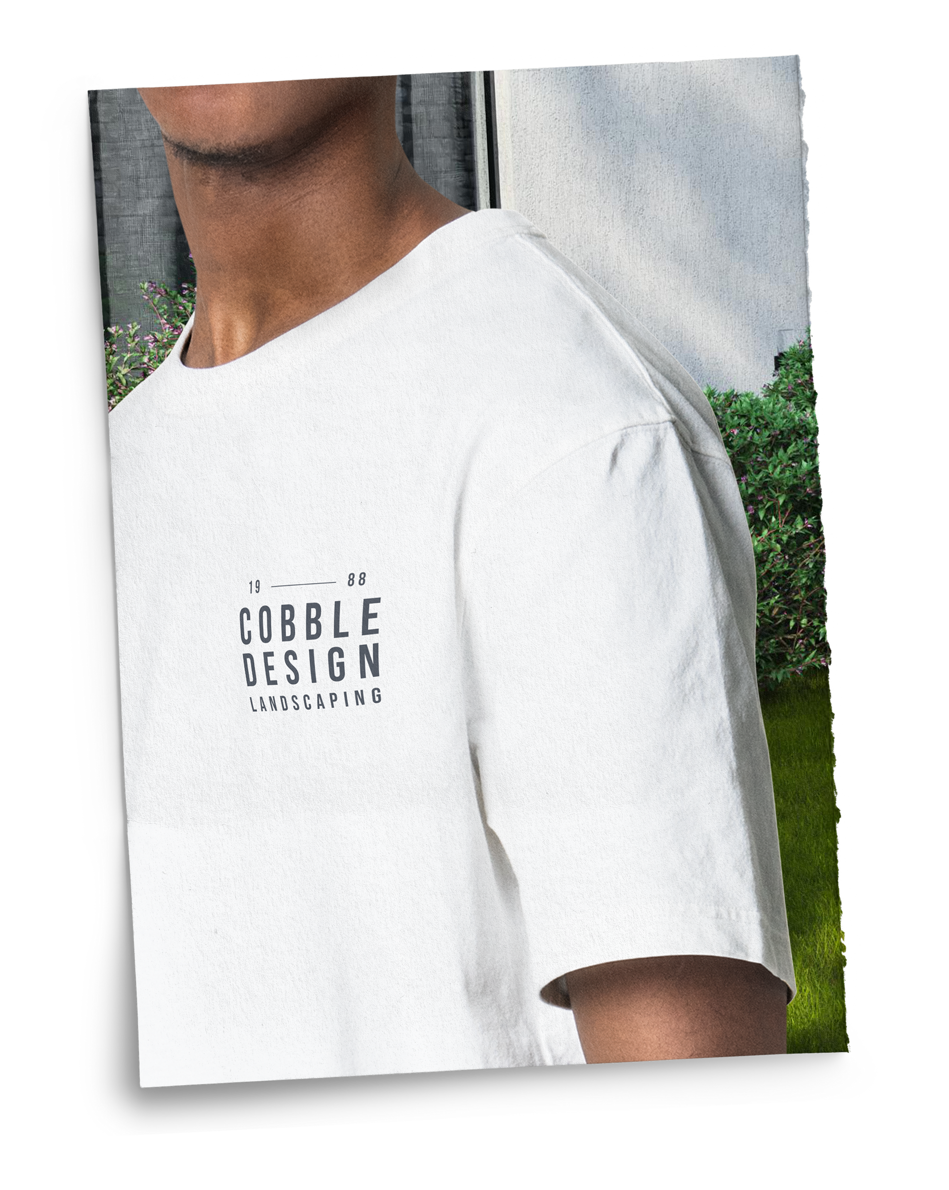 A man wearing a white t-shirt that says cobalt design