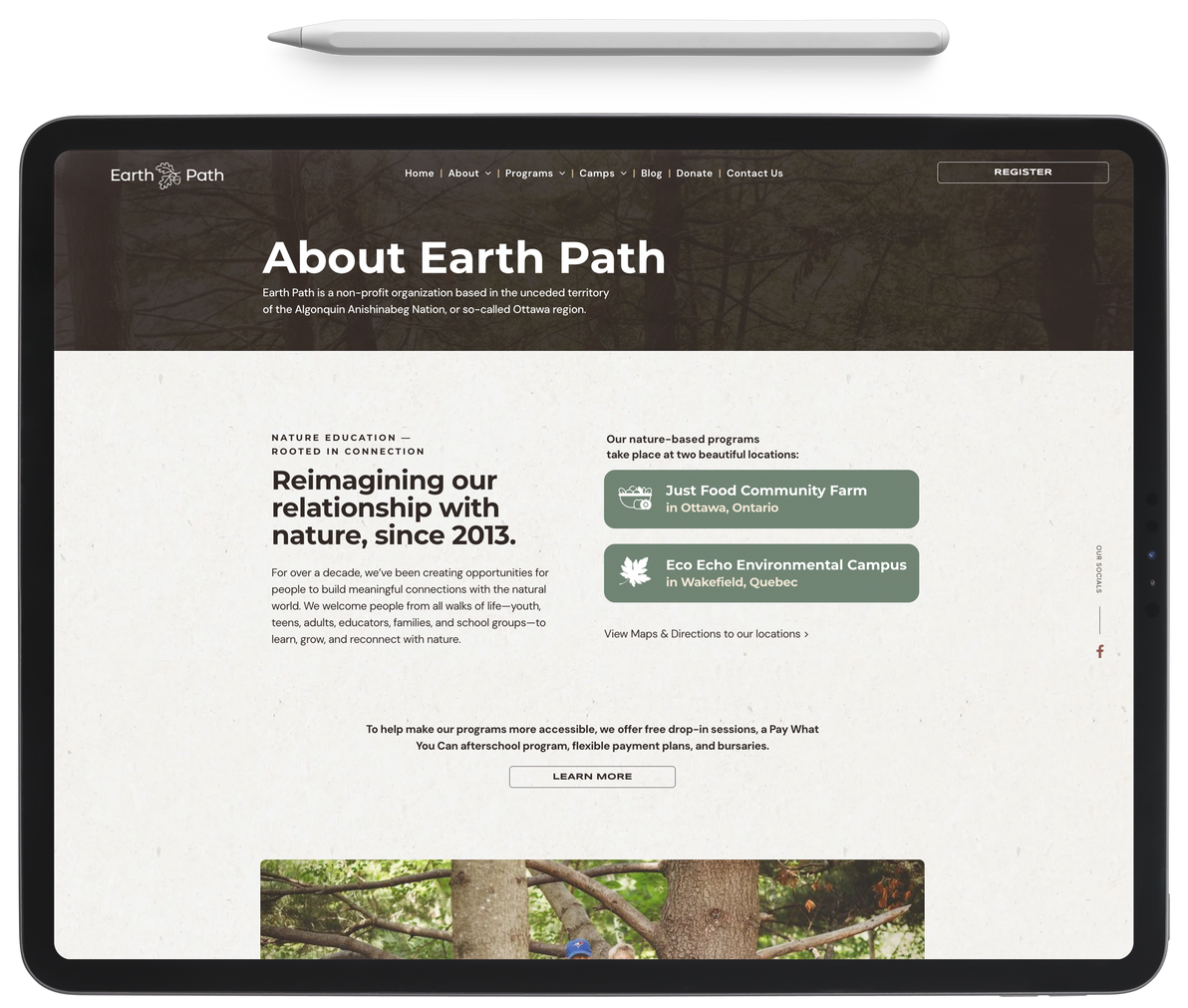 A tablet with the website about earth path on it.