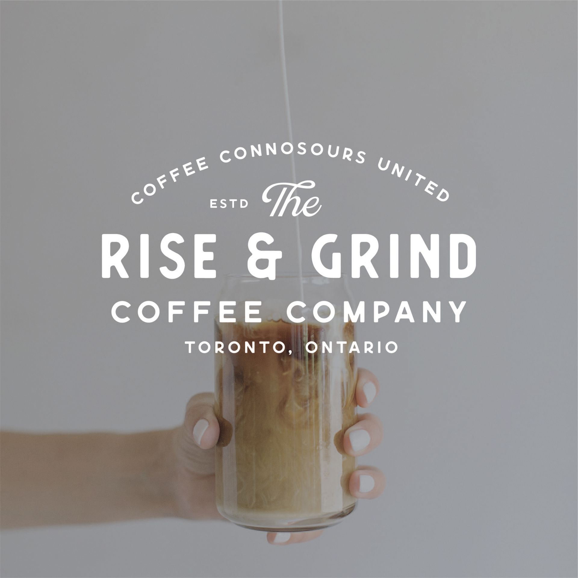 A person is holding a glass of coffee from the rise & grind coffee company showing logos for small business