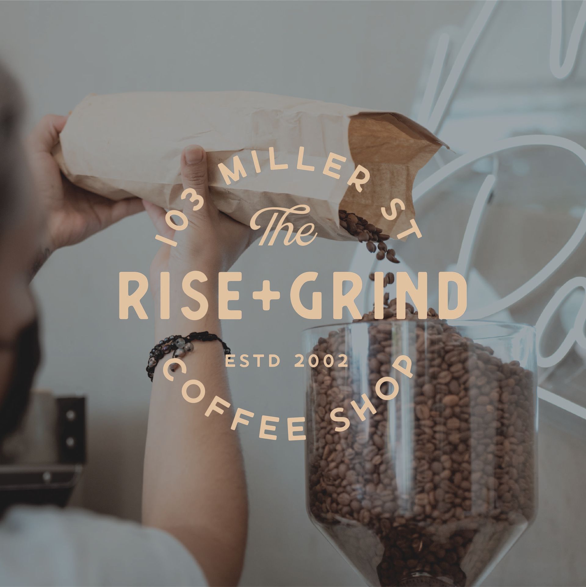 A logo for the rise and grind coffee shop