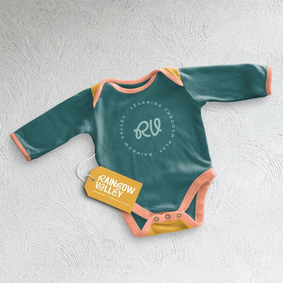 Baby onesie with a tag that says 