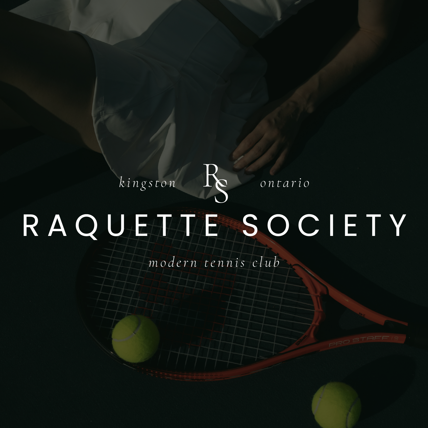 A person is holding a racquet with the words raquette society on it